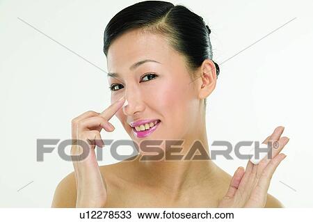 Stock Image - Black Hair, Toothy Smile, Moisturizer, Applying. Fotosearch