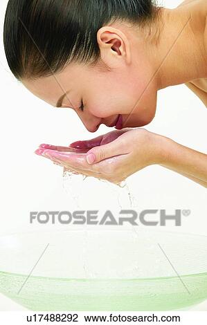 Stock Image - Indoor, Black Hair, Eyes Closed, One Young Woman Only, Human Ear. Fotosearch