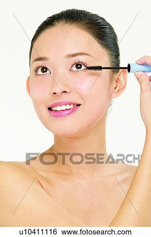 Stock Photograph - Preparation, Beauty Treatment, One Person, Eyeliner, Head And Shoulders. Fotosearch