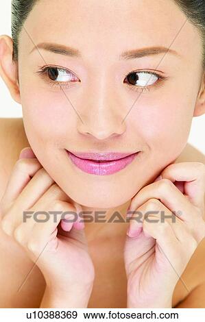 Stock Photo - Head And Shoulders, One Young Woman Only, Human Hand, Touching, Thinking. Fotosearch