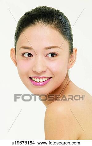 Indoor, Black Hair, Looking Away, Smiling, Young Adult View Large Photo Image Picture - Indoor, Black Hair, Looking Away, Smiling, Young Adult. Fotosearch
