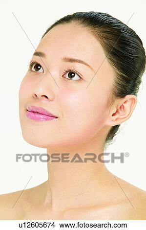 Picture - Thinking, White Background, One Young Woman Only. Fotosearch