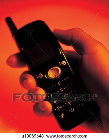 Stock Photo - device, cell phone, instrument, connection, plastic body, mobile, display. Fotosearch