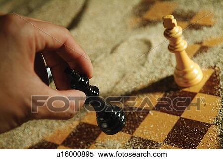 Chess Piece, Human Hand, Close-Up, Leisure Activity, Strategy View Large Photo Image Stock Photography - Chess Piece, Human Hand, Close-Up, Leisure Activity, Strategy. Fotosearch