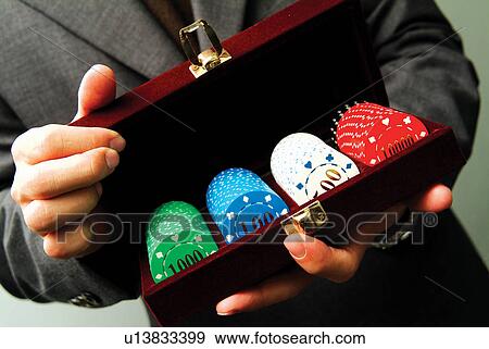 Stock Photo - Close-Up, Gambling Chip, Holding. Fotosearch