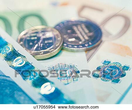 Picture - metal, income, folding money, international, banking, round, investment. Fotosearch