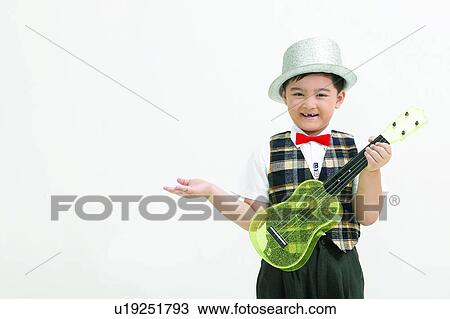Stock Image - Cheerful, Asian Ethnicity, Bow Tie, Body Language, Black Hair, Child, 6-7 Years. Fotosearch