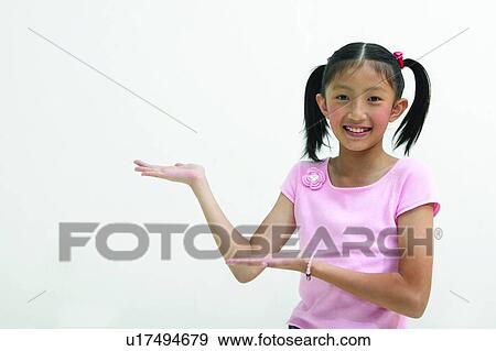 Cheerful, Asian Ethnicity, Casual Clothing, Body Language, Black Hair, Child, 8-9 Years View Large Photo Image Stock Photo - Cheerful, Asian Ethnicity, Casual Clothing, Body Language, Black Hair, Child, 8-9 Years. Fotosearch