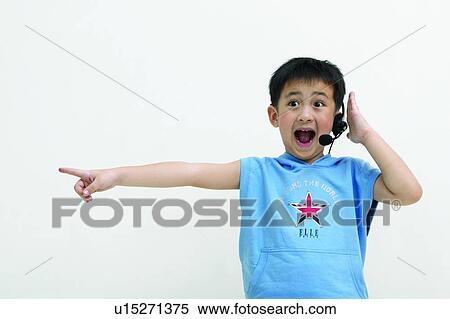 Stock Photography - Child, Asian Ethnicity, Casual Clothing, Body Language, Black Hair, Close-Up, 6-7 Years. Fotosearch