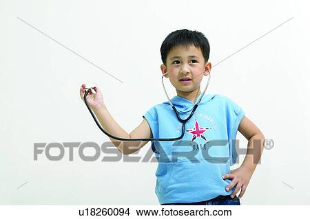 Close-Up, Child, Standing, Hand On Hip, Kids Body Language, Elementary Age, Holding View Large Photo Image Picture - Close-Up, Child, Standing, Hand On Hip, Kids Body Language, Elementary Age, Holding. Fotosearch