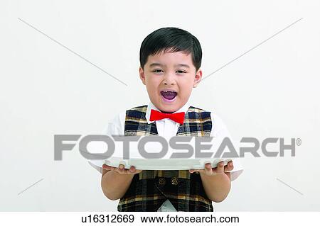 Mouth Open, Holding, Food And Drink, Standing, One Boy Only, Happiness View Large Photo Image Stock Photo - Mouth Open, Holding, Food And Drink, Standing, One Boy Only, Happiness. Fotosearch