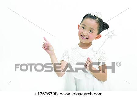 Stock Photo - Star Shape, Fairy Costume, 6-7 Years, Elementary Age, Looking Away, White Background. Fotosearch