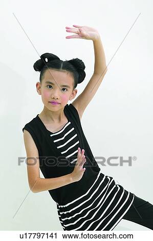Stock Image - Tween, Gesturing, Indoor, 10-11 Years, Casual Clothing, Child, Black Hair. Fotosearch