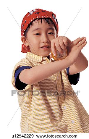 Stock Photo - asian ethnicity, bandana, background, 5-6 years. Fotosearch
