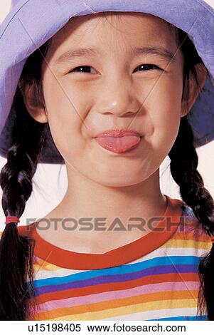 childhood, child, funny face, asian ethnicity, sticking out tongue, playful View Large Photo Image Stock Photography - childhood, child, funny face, asian ethnicity, sticking out tongue, playful. Fotosearch