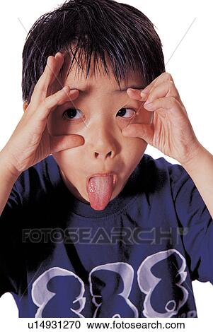 Stock Image - childhood, funny face, looking sideways, head and shoulders, one person, 5-6 years. Fotosearch