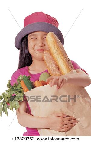 Stock Image - consumerism, emotion, happy, asian ethnicity, shopping, childhood, expression. Fotosearch