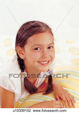 Stock Image - brown hair, braid, carefree, casual. Fotosearch