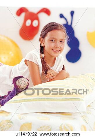 Stock Image - brown hair, braid, carefree, casual. Fotosearch