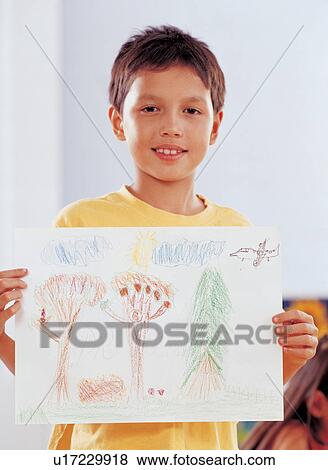 Stock Photo - coloring, innocence, 6-7 years, portrait, children's wear, art. Fotosearch