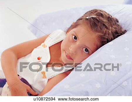 expression, culture, innocence, pillow, brown hair, 5-6 years View Large Photo Image Picture - expression, culture, innocence, pillow, brown hair, 5-6 years. Fotosearch