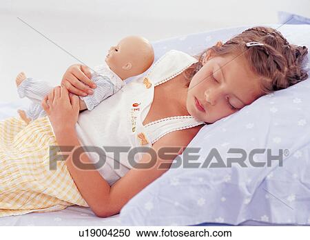 lifestyle, expression, top, sleeping, doll, child, one person View Large Photo Image Stock Image - lifestyle, expression, top, sleeping, doll, child, one person. Fotosearch