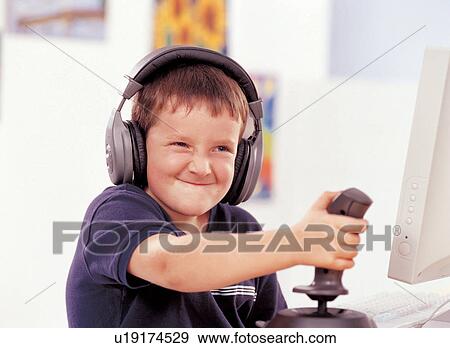 sitting, game, innocence, monitor, head and shoulders, children's wear, indoor View Large Photo Image Stock Photo - sitting, game, innocence, monitor, head and shoulders, children's wear, indoor. Fotosearch