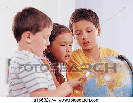 Picture - world, casual, innocence, globe, children's wear, kids, human face. Fotosearch