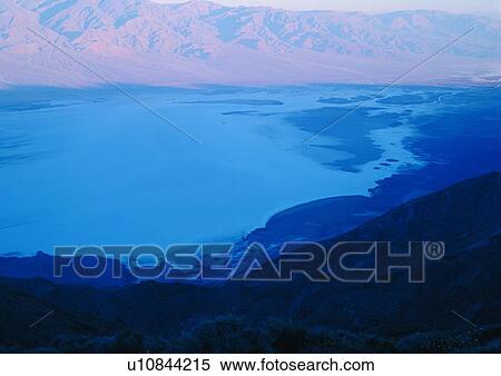 Stock Photography - Cliff, Scenics, Arid, Extreme Terrain, Blue, Rugged. Fotosearch