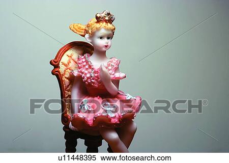 Stock Photography - Ballerina, Blond Hair, Chair, Close-Up, Colored Background. Fotosearch