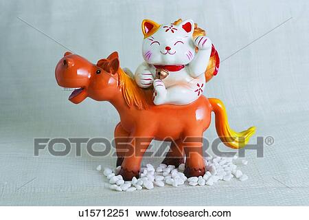 Stock Image - Cat, Decoration, Curio, Close-Up, Arms Raised. Fotosearch