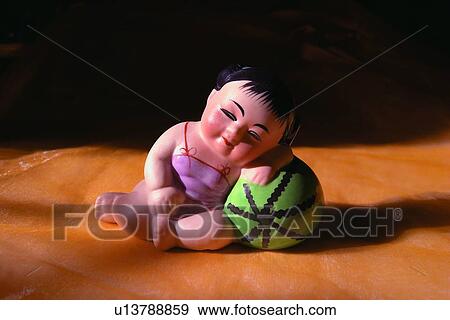 Stock Photo - Leaning, Life Stuff, Barefoot, Chinese Culture, Close-Up, Lying On Side. Fotosearch