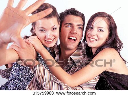 Stock Image - brown hair, happy, indoor, lifestyle, pals, friends. Fotosearch