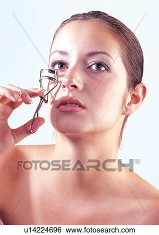 Stock Photograph - close-up, clean, lipstick, sparkling eyes, red, posing. Fotosearch
