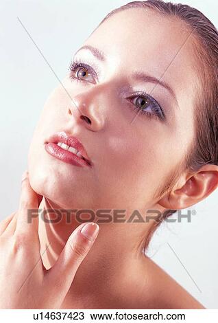 Stock Image - close-up, shadow, eye shadow, massaging, facial. Fotosearch