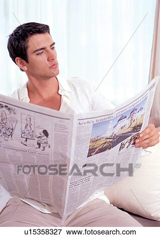 Stock Photo - day, young man, concentrating, male, cushion. Fotosearch