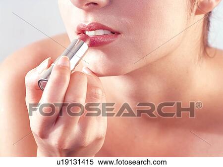 Stock Photography - makeup, beautifying, young woman, model, white background, indoor, lifestyle. Fotosearch