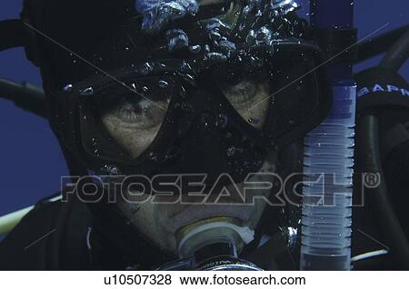 Stock Photo - Detail of scuba diver's face, Cayman Islands, Caribbean. Fotosearch