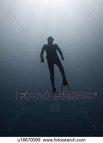 Freediver on his way to the surface. Ras Umm Sid, Sharm El Sheikh, South Sinai, Red Sea, Egypt. View Large Photo Image Stock Photo - Freediver on his way to the surface. Ras Umm Sid, Sharm El Sheikh, South Sinai, Red Sea, Egypt.. Fotosearch
