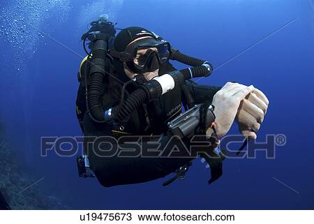 Stock Image - Technical Divers using Trimix, Rebreathers and technical diving equipment, Divetech, Grand Cayman, Cayman Islands, Caribbean. Fotosearch