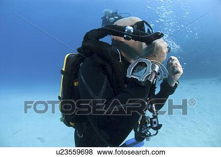 Stock Photo - Technical Divers using Trimix, Rebreathers and technical diving equipment, Divetech, Grand Cayman, Cayman Islands, Caribbean. Fotosearch