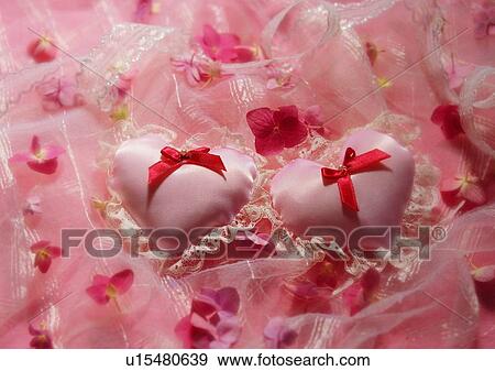 Stock Photo - bow, petal, flower, love, silk, pillow. Fotosearch