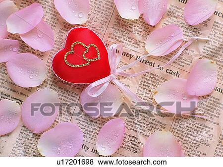 gold, newspaper, romantic, ribbon, heart shaped, love View Large Photo Image Stock Photo - gold, newspaper, romantic, ribbon, heart shaped, love. Fotosearch