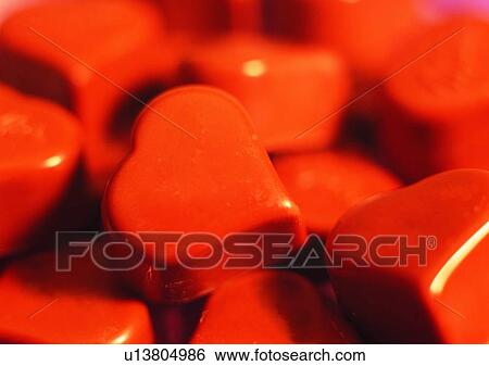 Stock Photograph - heart shaped, chocolate, brown, light, pile, shadow. Fotosearch