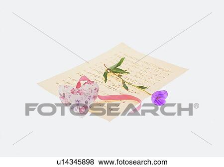 Stock Photo - heart shaped, ribbon, flower, purple, pink. Fotosearch