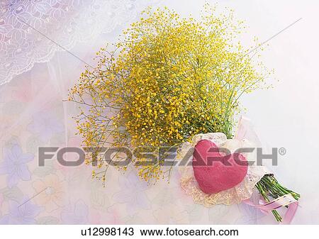 Stock Image - heart shaped, yellow, flower, bouqute, ribbon, red. Fotosearch