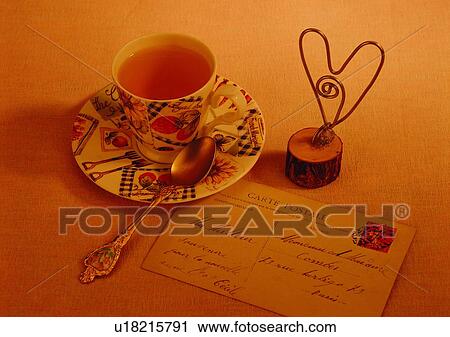 Stock Image - light, tea, spoon, postcard, love, saucer. Fotosearch