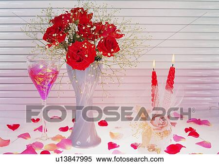 Stock Photography - red, rose, vase, wine glasses, candle, petal. Fotosearch