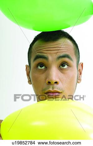 Balloon, Close-Up, Carrying On Head, Asian Ethnicity View Large Photo Image Picture - Balloon, Close-Up, Carrying On Head, Asian Ethnicity. Fotosearch