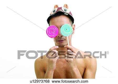 Bare Chest, Cap, Candy, Blue, Asian Ethnicity View Large Photo Image Stock Photo - Bare Chest, Cap, Candy, Blue, Asian Ethnicity. Fotosearch